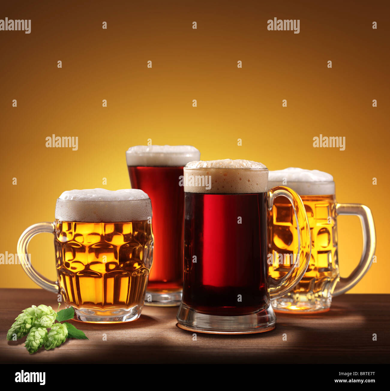 Still-life with beer glasses. On a yellow background. Stock Photo