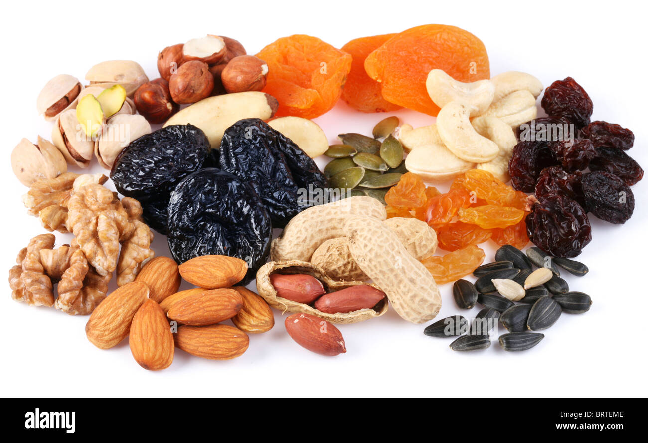 Group of different dried fruits and nuts on a white background. Stock Photo