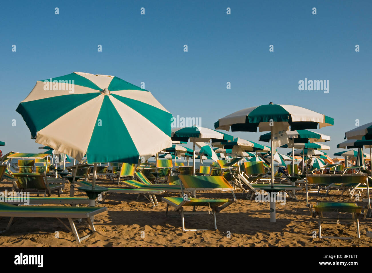 Empty Beach Umbrellas and Deckchairs, Spiaggia di Ponente, Caorle, Veneto,  Italy Stock Photo - Alamy