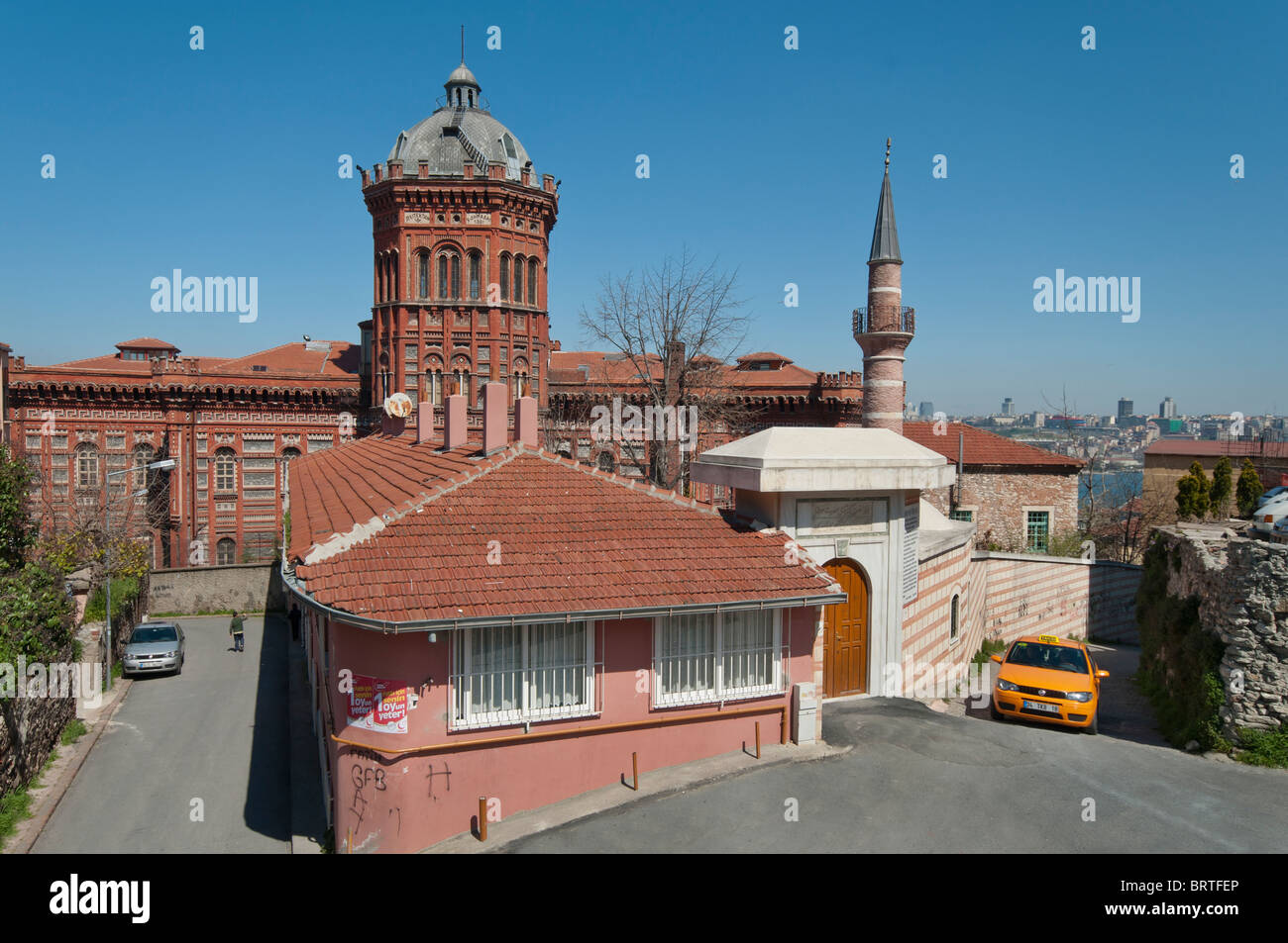 The old Fener lycee (high-school) of the Greek patriarchate of Constantinople and a mosque,Istanbul, Turkey Stock Photo