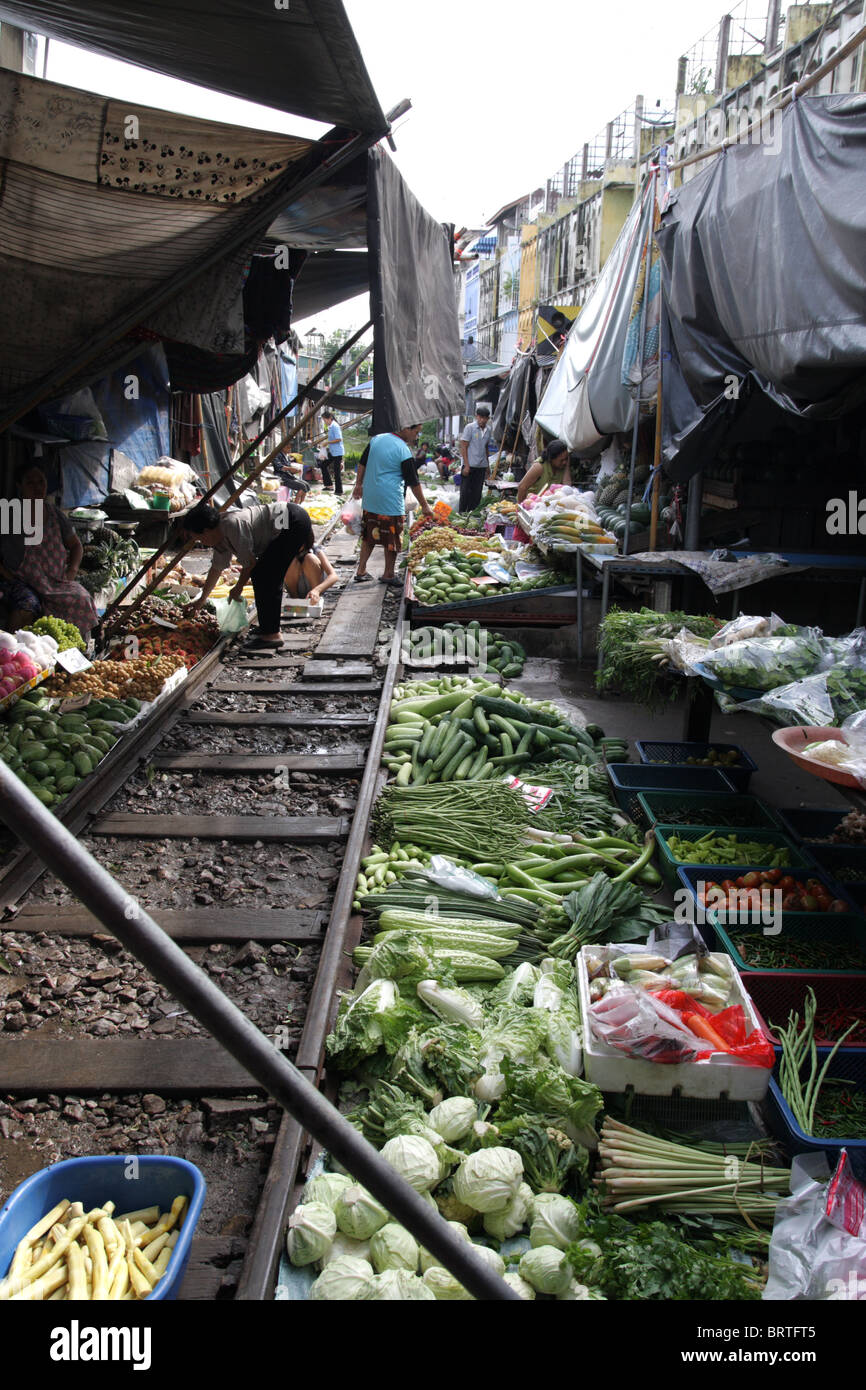 A food market on the rail tracks , Maeklong railway market , Thailand Stock Photo