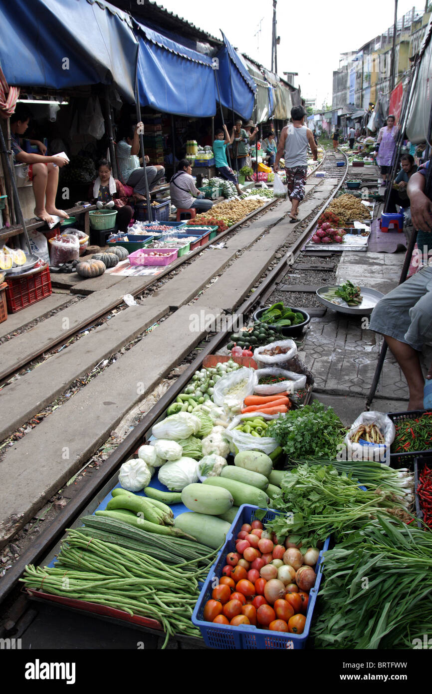 A food market on the rail tracks , Maeklong railway market , Thailand Stock Photo