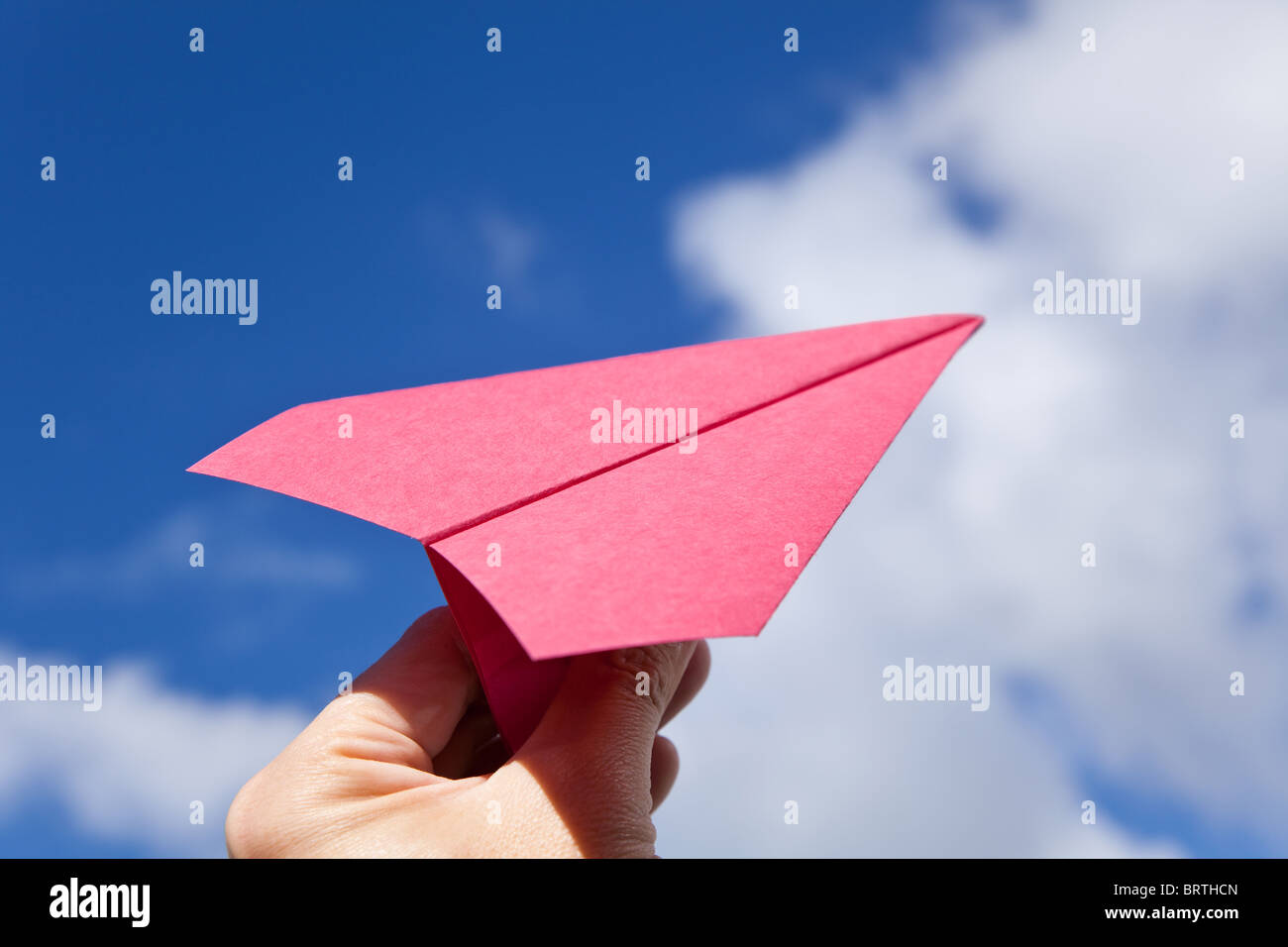 Red Paper Airplane and blue sky Stock Photo - Alamy