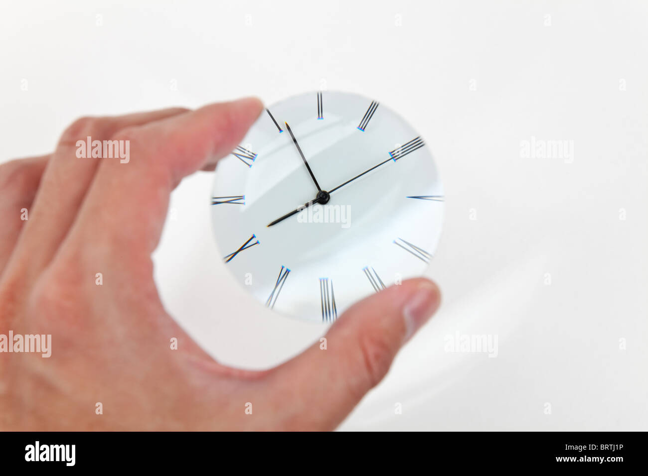 Magnifying Glass Focus on a Clock Stock Photo