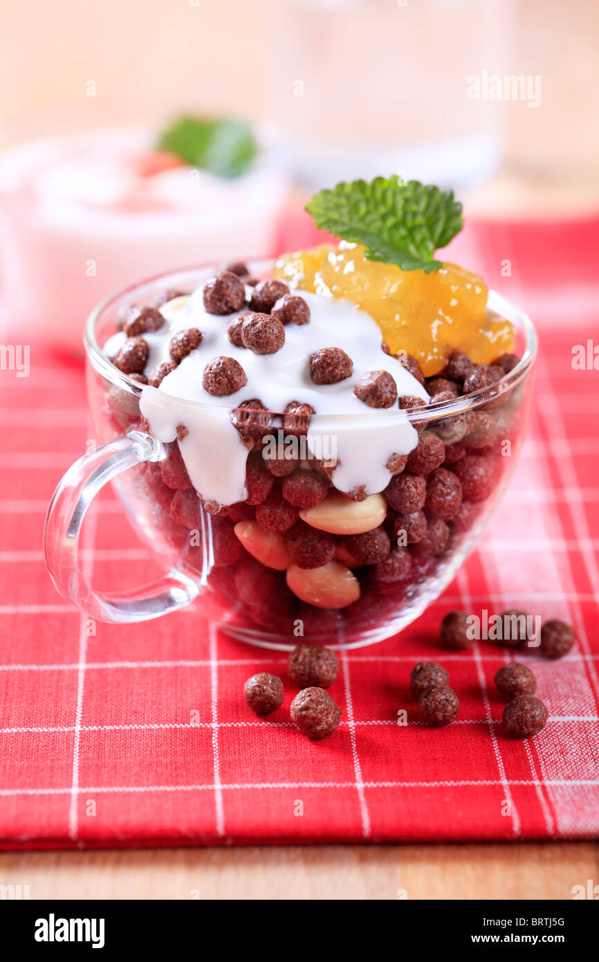 Chocolate breakfast cereal with yogurt and preserve Stock Photo Alamy