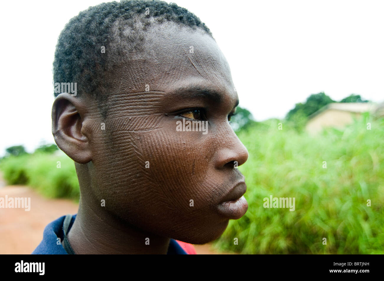 Portrait of a Somba man. The Somba people scar their faces with many tiny linear scars. Stock Photo