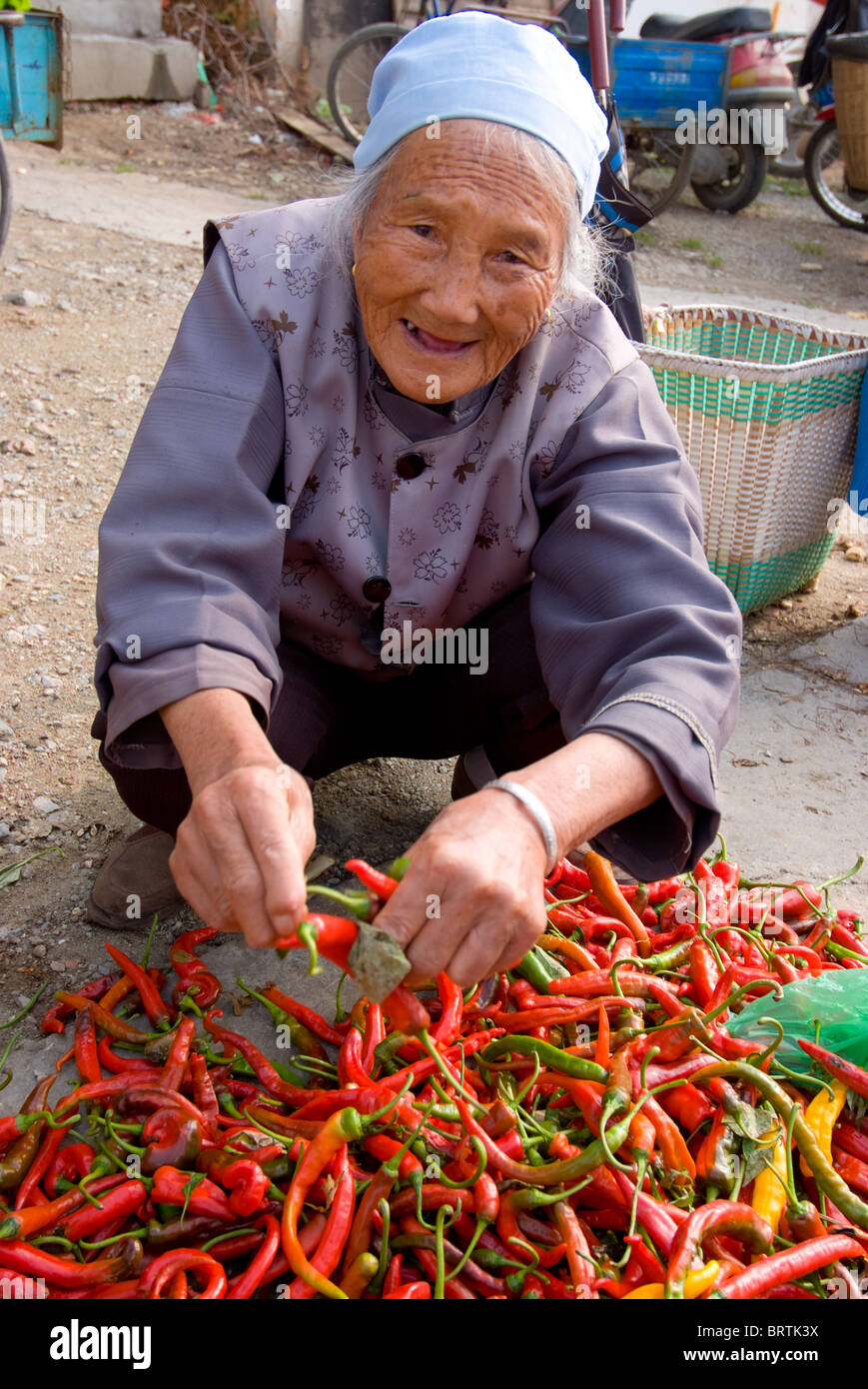Woman selling chillies hi-res stock photography and images - Alamy