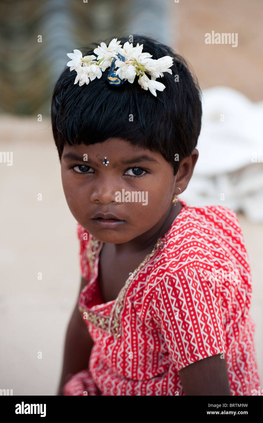 Small Indian village girl with flowers in her hair. Puttaparthi, Andhra  Pradesh, India Stock Photo - Alamy