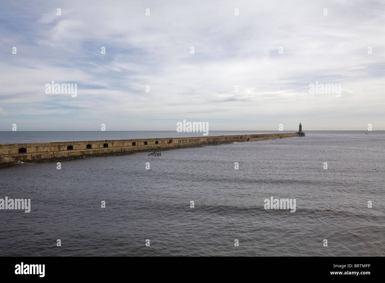 The North Pier Lighthouse at the mouth of the Tyne RIver, Tynemouth. Stock Photo