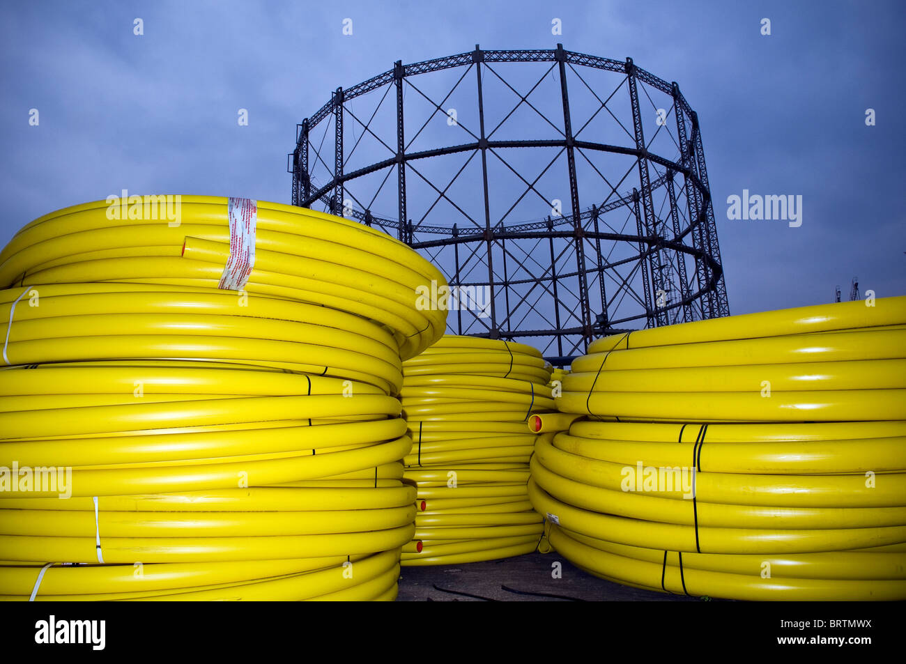 Coiled plastic gas pipes at a gas works in Cardiff, South Wales, UK