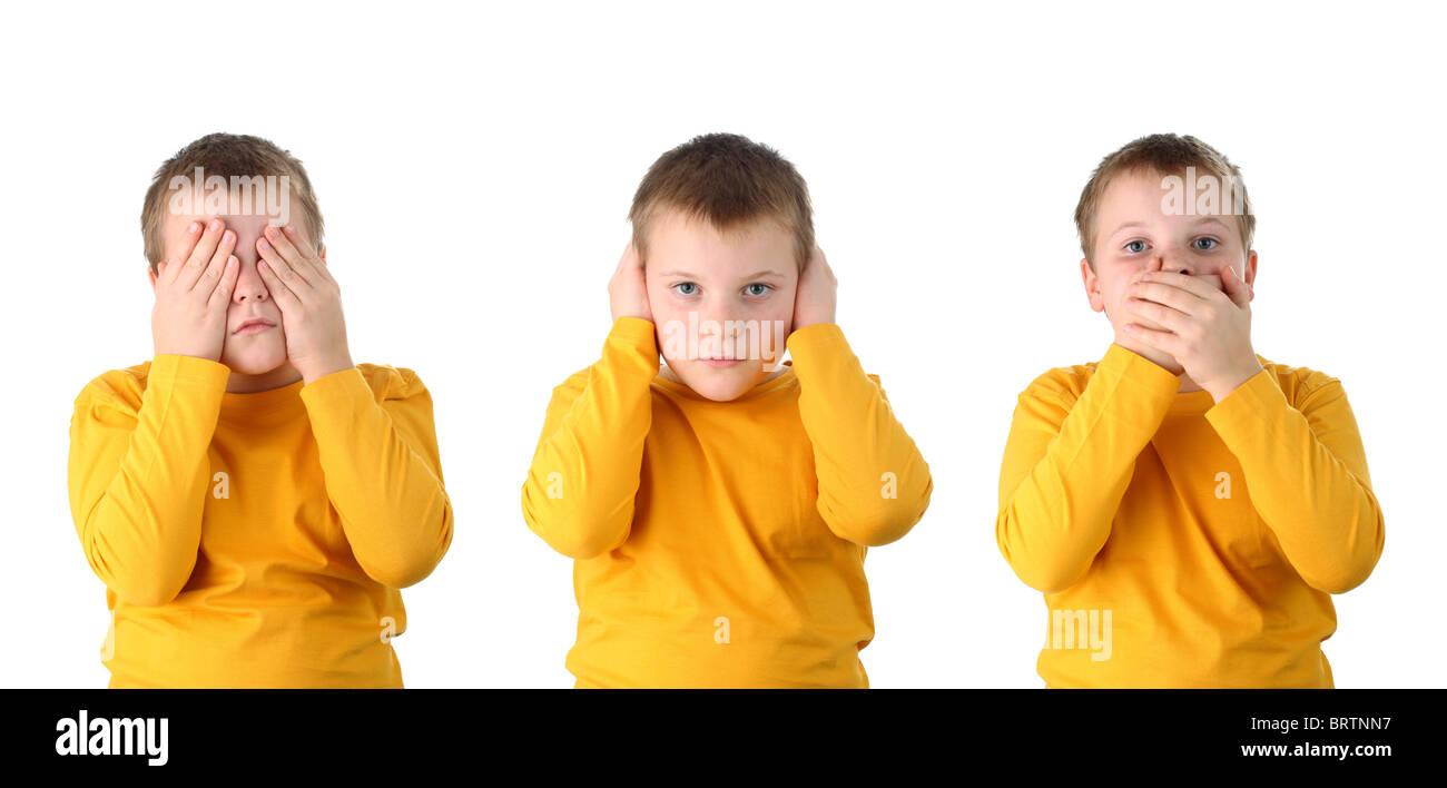 See no evil hear no evil speak no evil performed by a 10 year old boy isolated on white Stock Photo