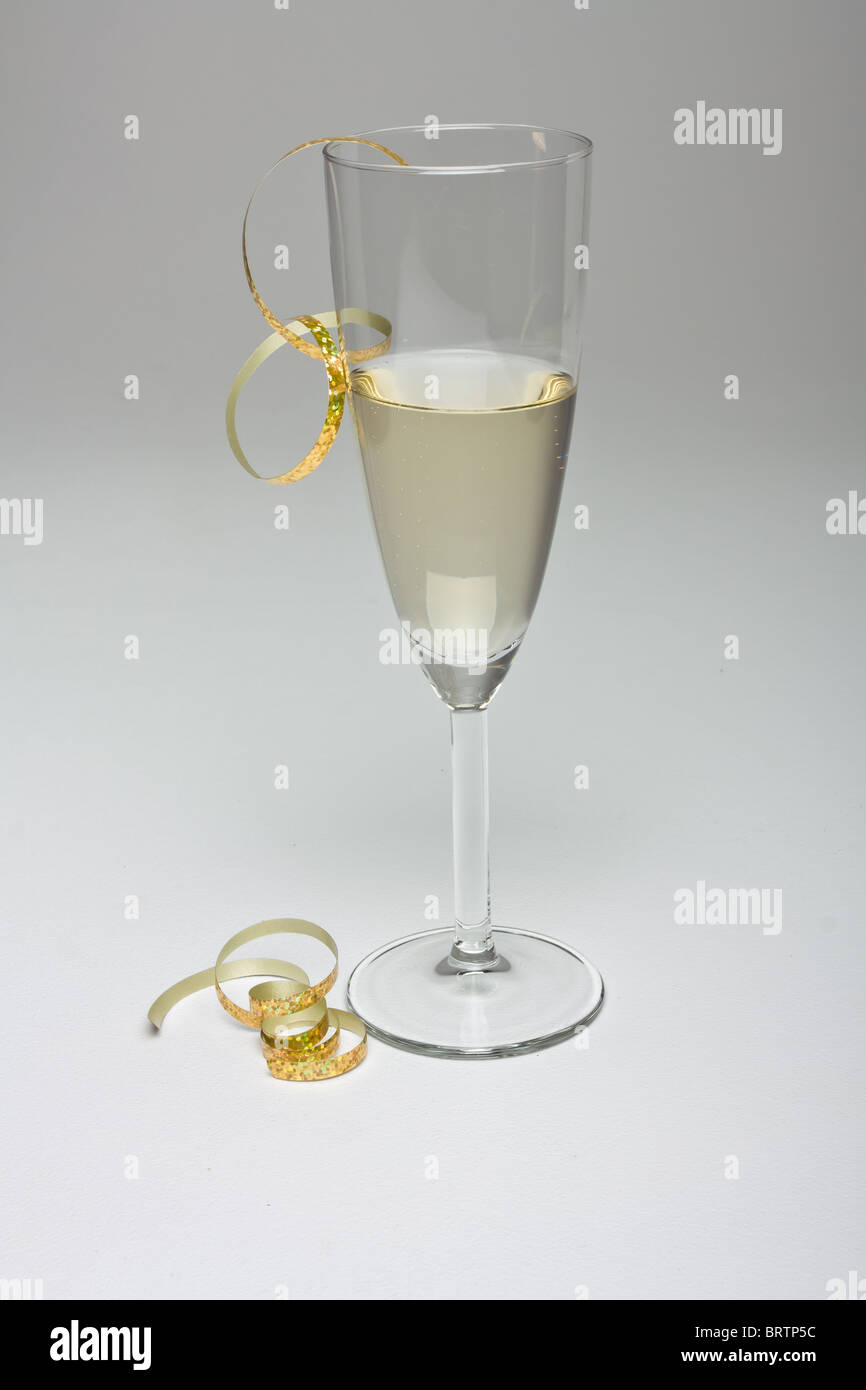 Champagne flute with festive decoration isolated on graduated