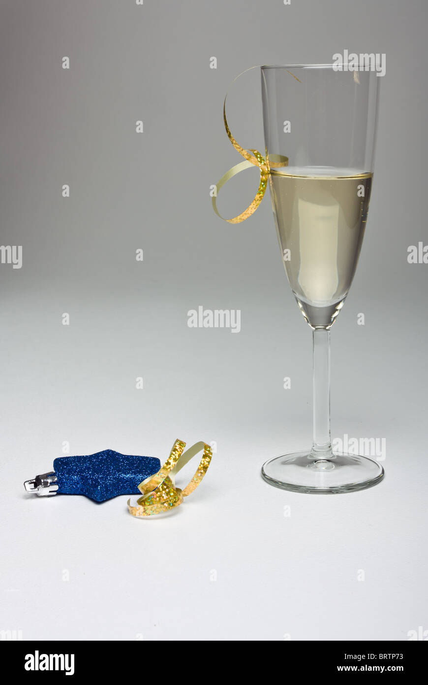 Champagne Flute With Festive Decoration Isolated On Graduated Background Stock Photo Alamy