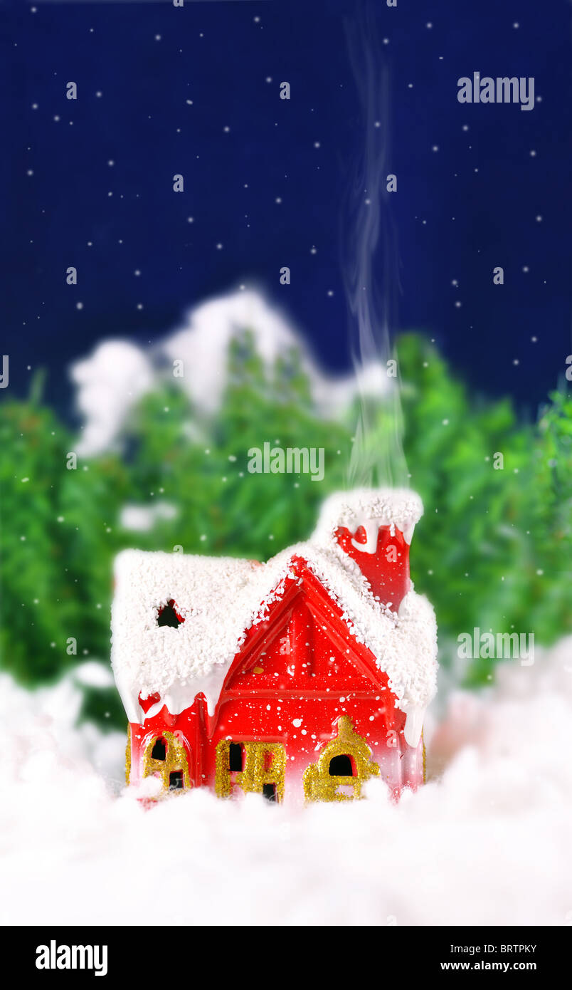 Christmas card with a house in the woods and snowing Stock Photo - Alamy