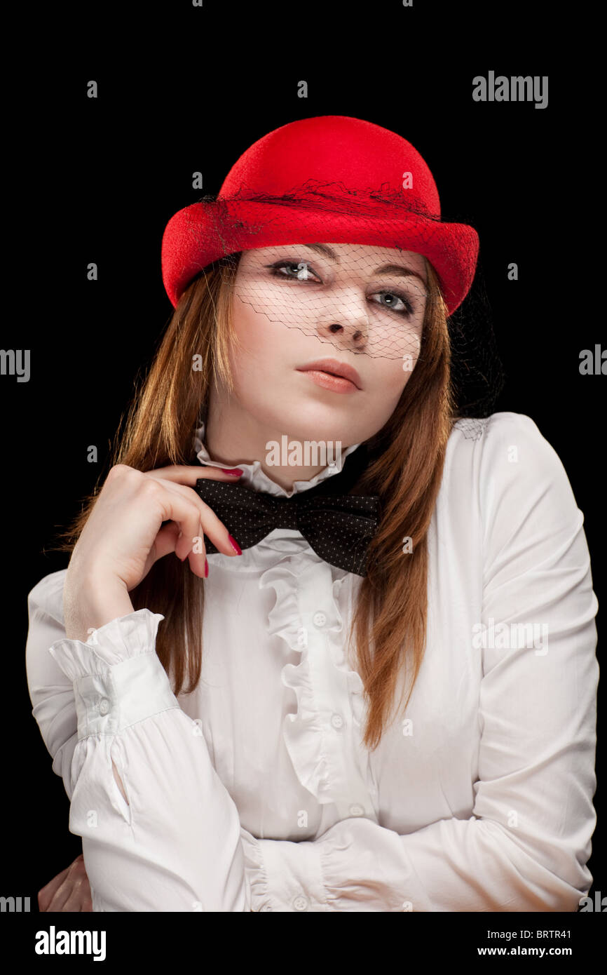 Portrait of a pretty young woman with red bonnet Stock Photo - Alamy