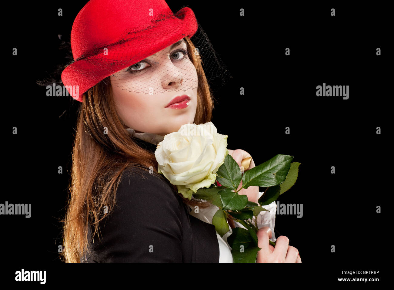 Portrait of a pretty young woman with red bonnet Stock Photo - Alamy