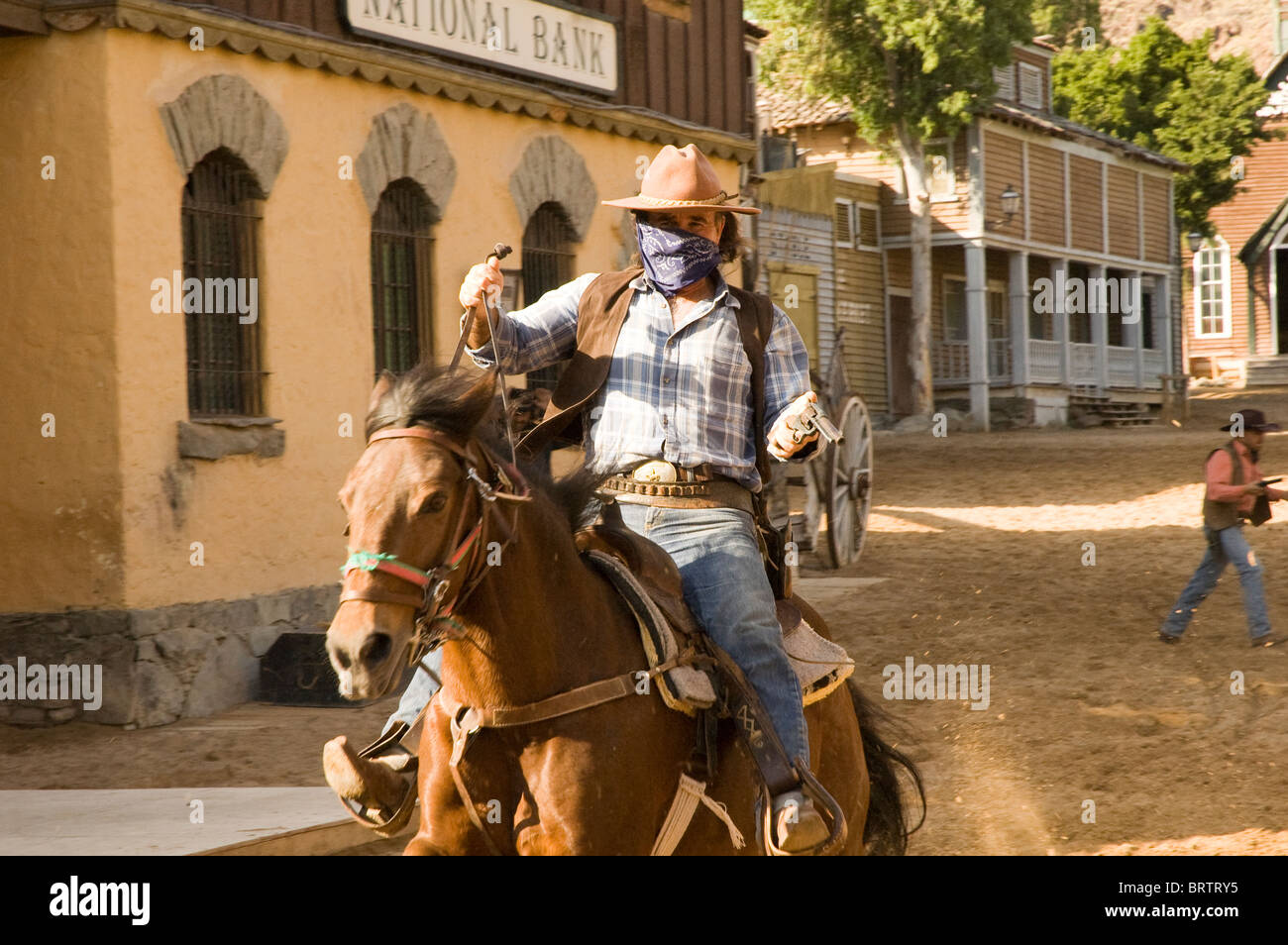 Cowboy riding horse back in Sioux City a western tourist attraction in Gran Canaria Stock Photo