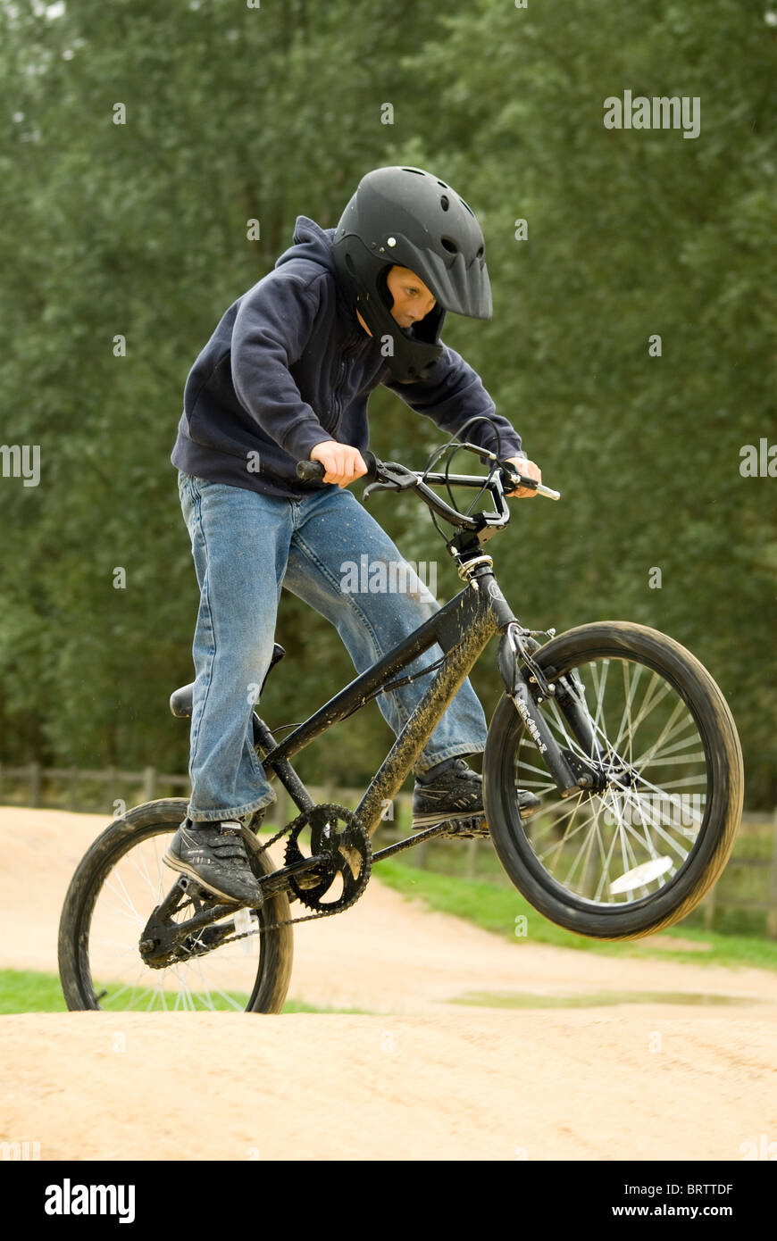 Child riding a BMX on a track Stock Photo Alamy
