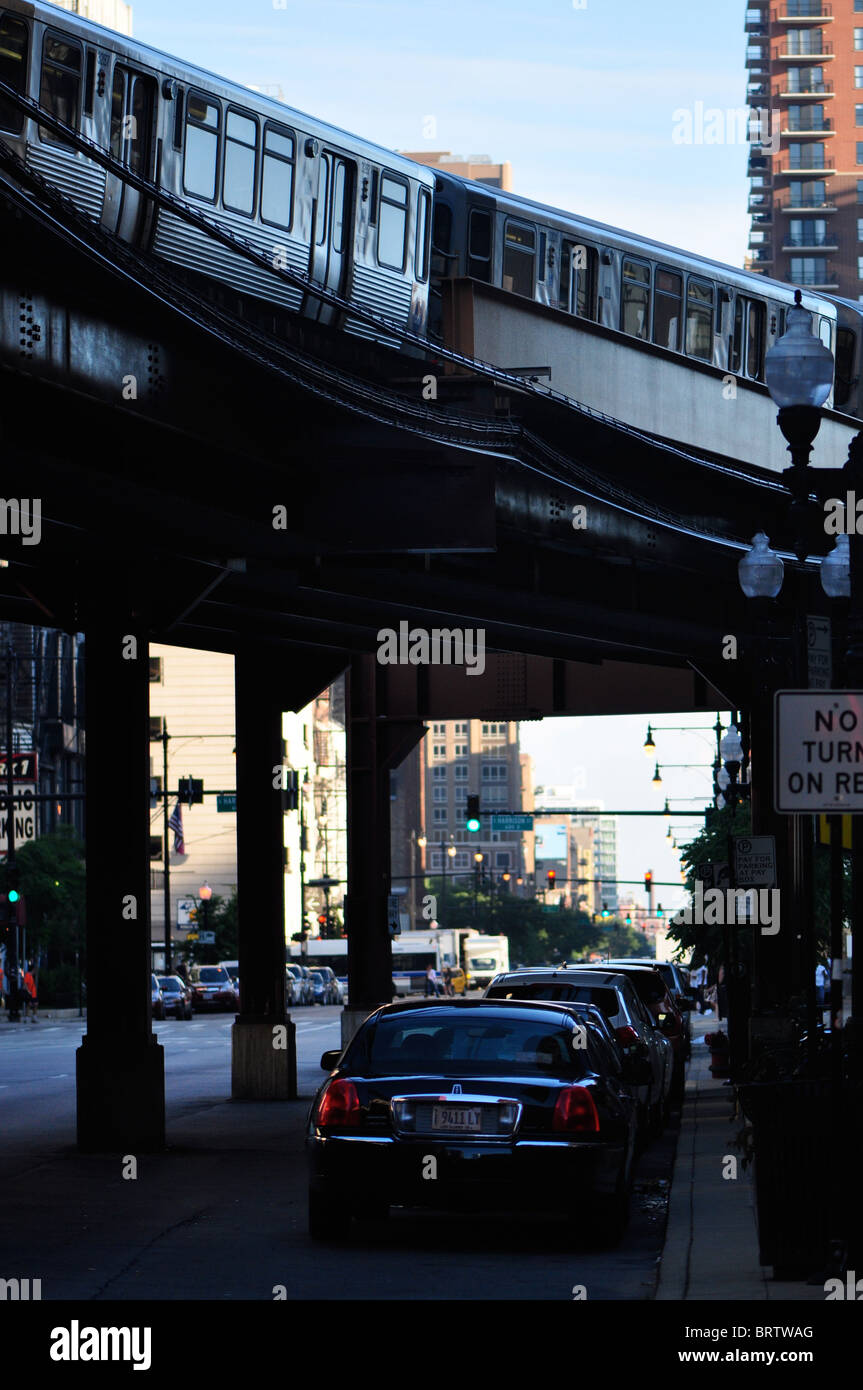 L train passing over cars in Chicago's The Loop Stock Photo