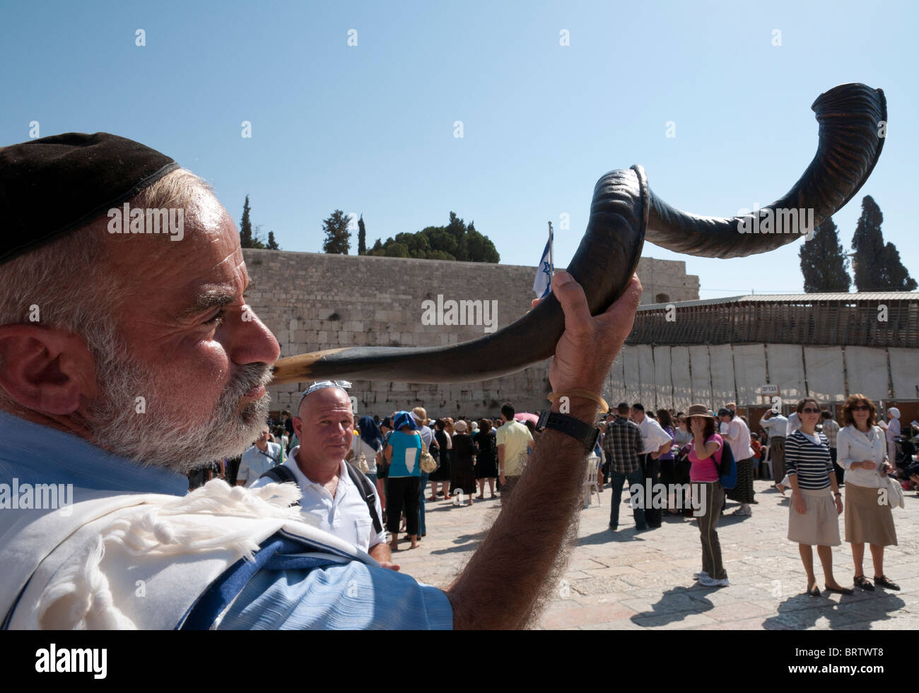Jew blowing a shofar horn at the western wall. Jerusalem, Israel Stock