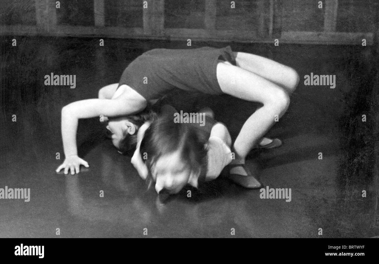Two girls doing gymnastics, historical image, ca. 1932 Stock Photo