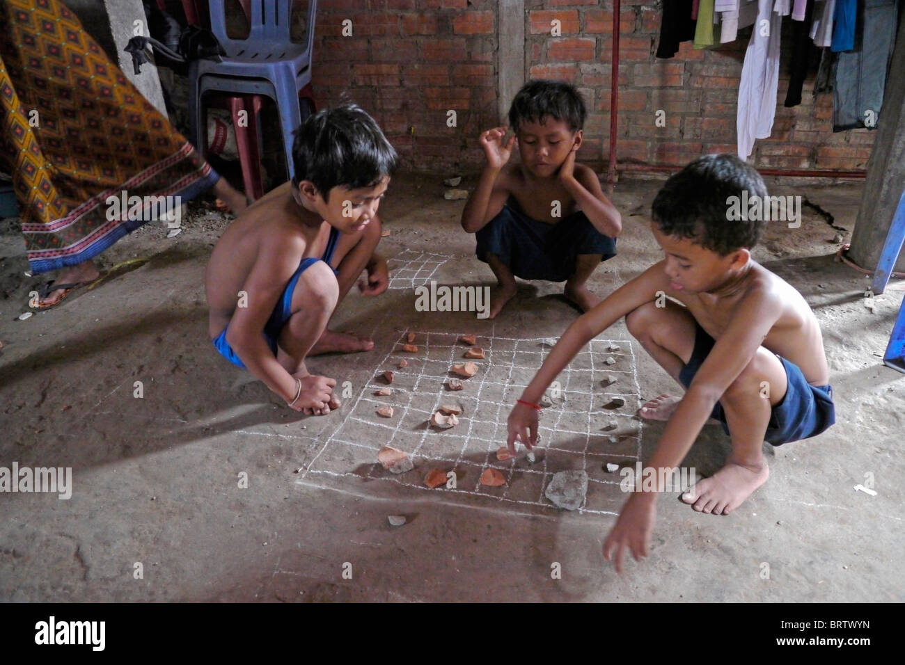 CAMBODIA Children playing game, Phnom Penh. PHOTO by SEAN SPRAGUE Stock Photo