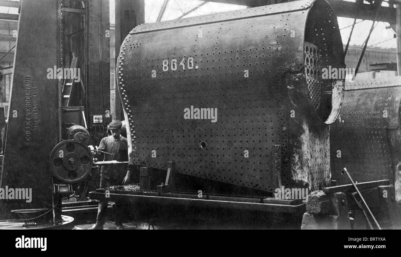 Construction of a locomotive, drilling stud holes on the boiler, Borsig factory, Berlin-Tegel, Germany, historical image, 1910 Stock Photo