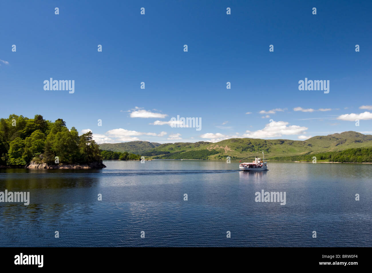 Loch Katrine and pleasure boat which is part of loch Lomond and Trossachs national park, Scotland on beautiful summer day Stock Photo