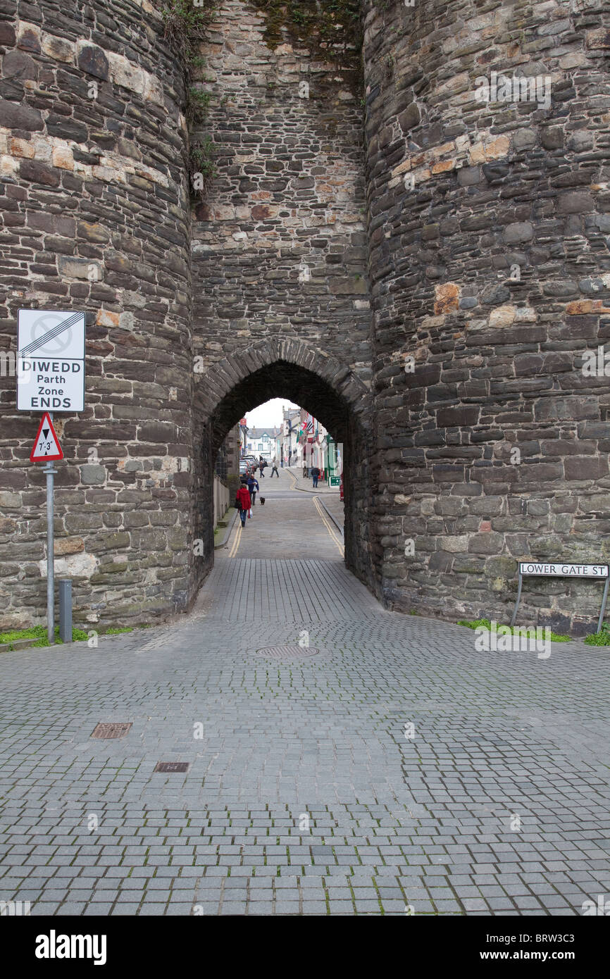 View of Lower Gate Street from the quay at Conwy Conway in North Wales looking through the arch leading to the town centre Stock Photo