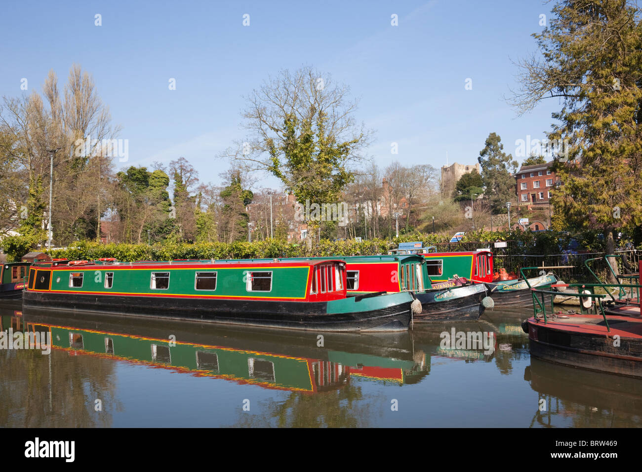 River Wey with canal boats moored on the Godalming Navigation. Guildford Surrey England UK Britain Stock Photo