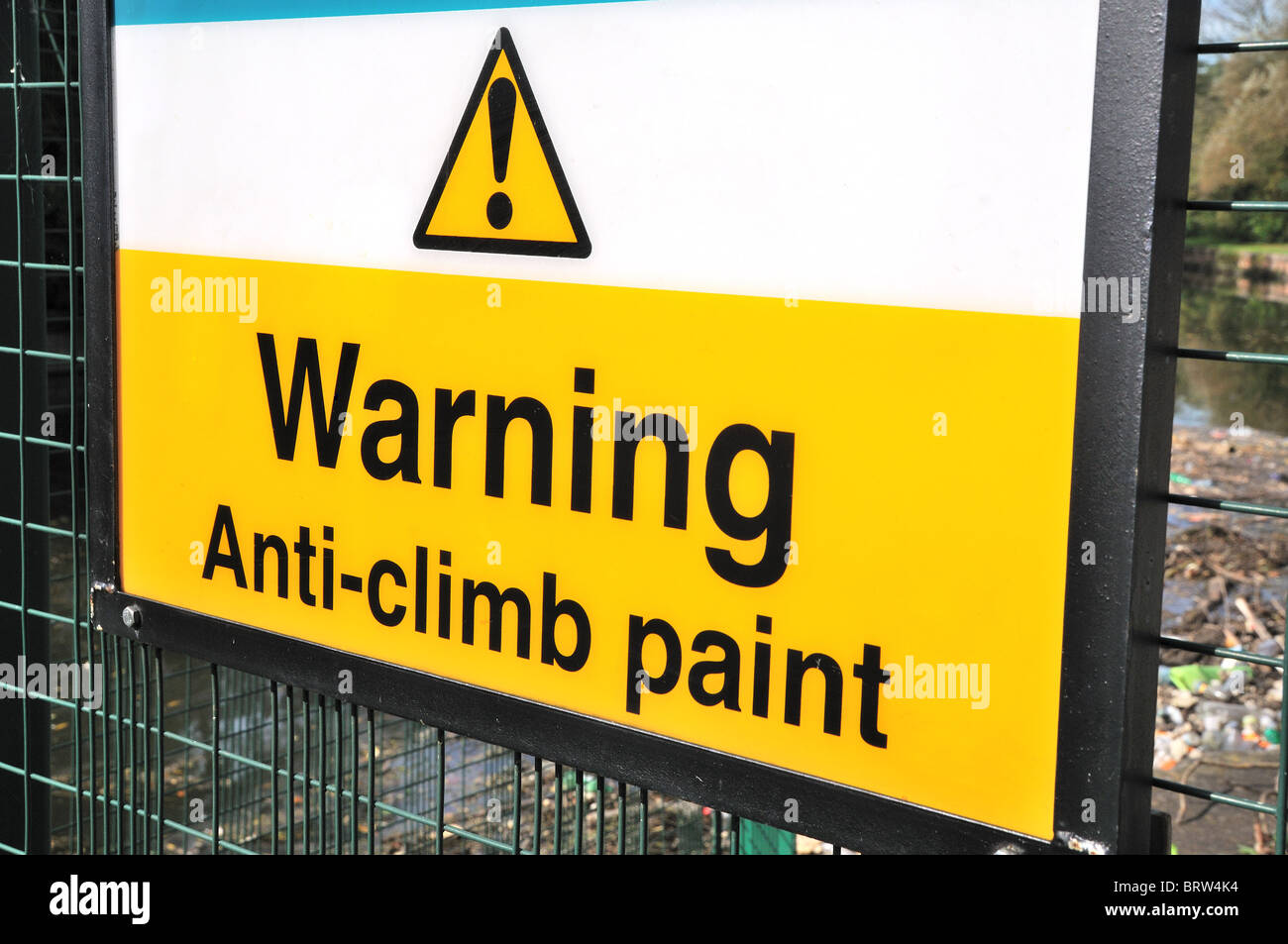 Warning sign for anti climb paint Stock Photo Alamy