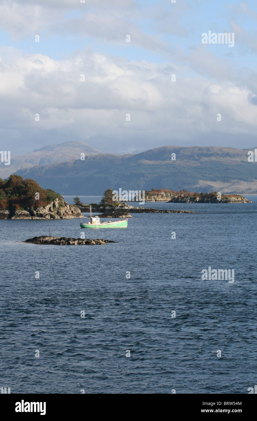 fishing boat in Kyle Akin with Isle of Skye Scotland  October 2010 Stock Photo