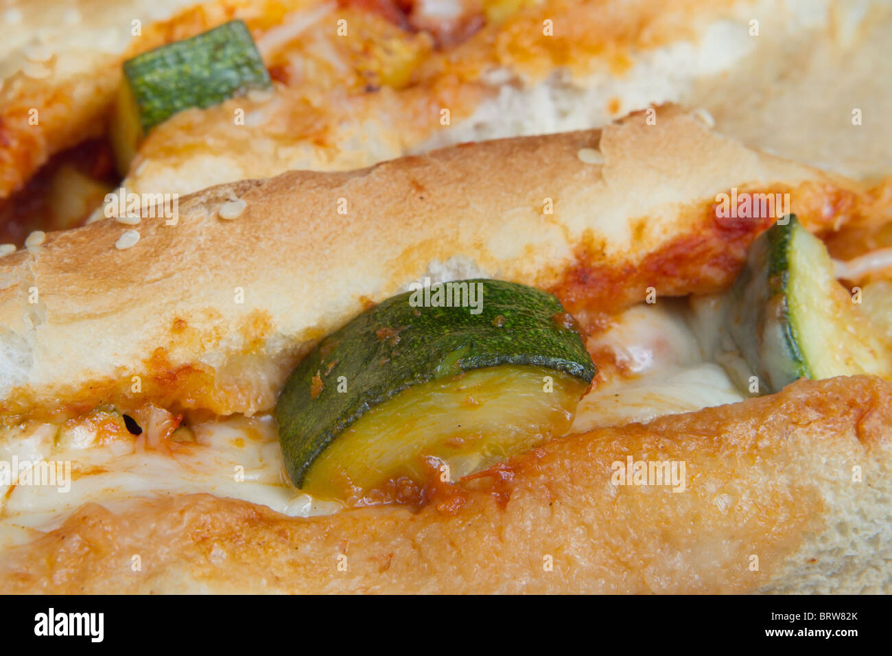 closeup of zucchini grinder sandwiches with melted mozzarella Stock