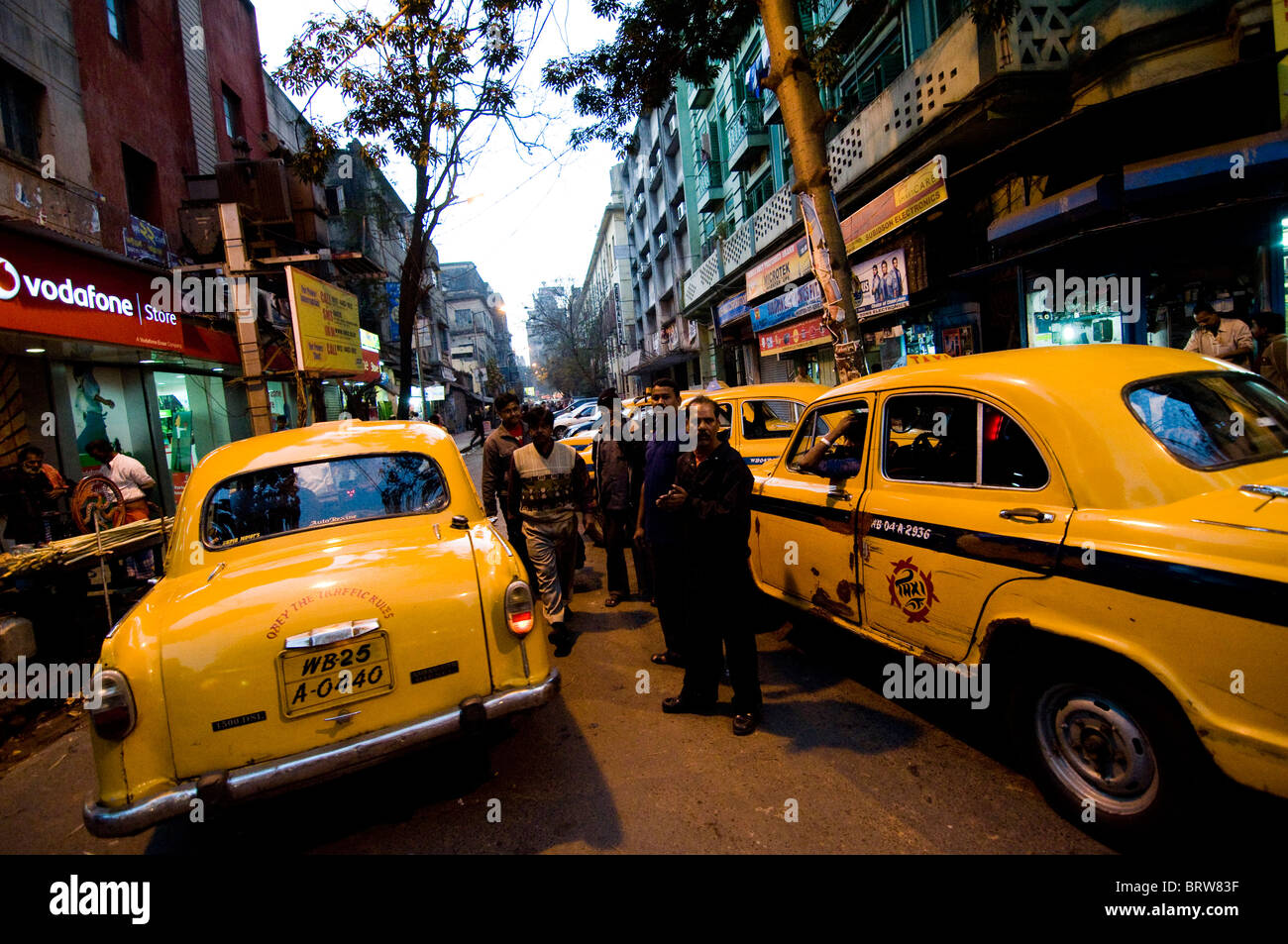 Yellow Ambassador taxis in the streets of Kolkata, India. Stock Photo
