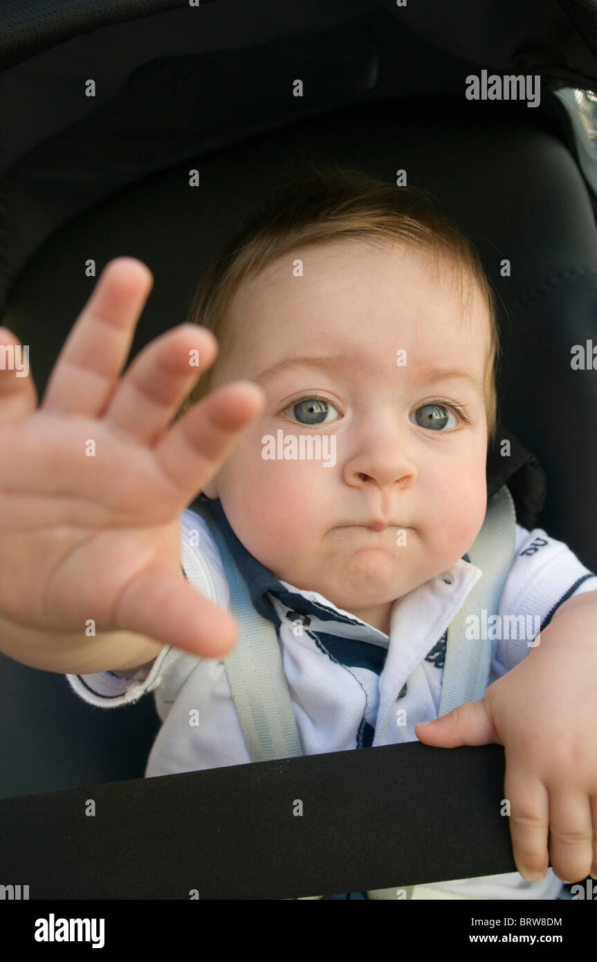 one year old baby raising his hand Stock Photo Alamy
