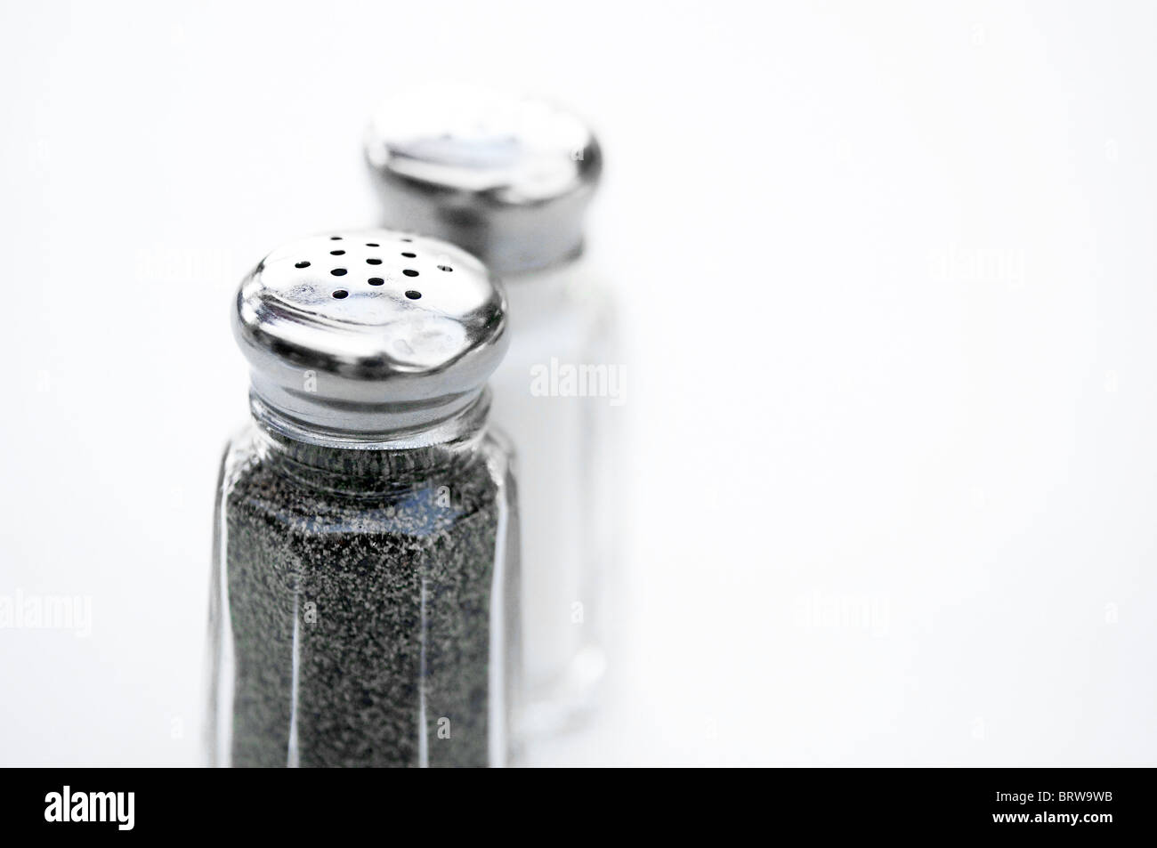 Photo of salt and pepper on restaurant table Stock Photo
