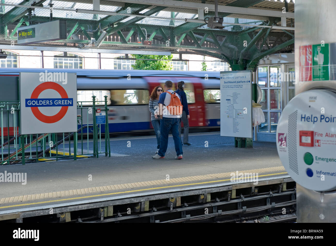 Golders Green underground station , passengers on platform boy with
