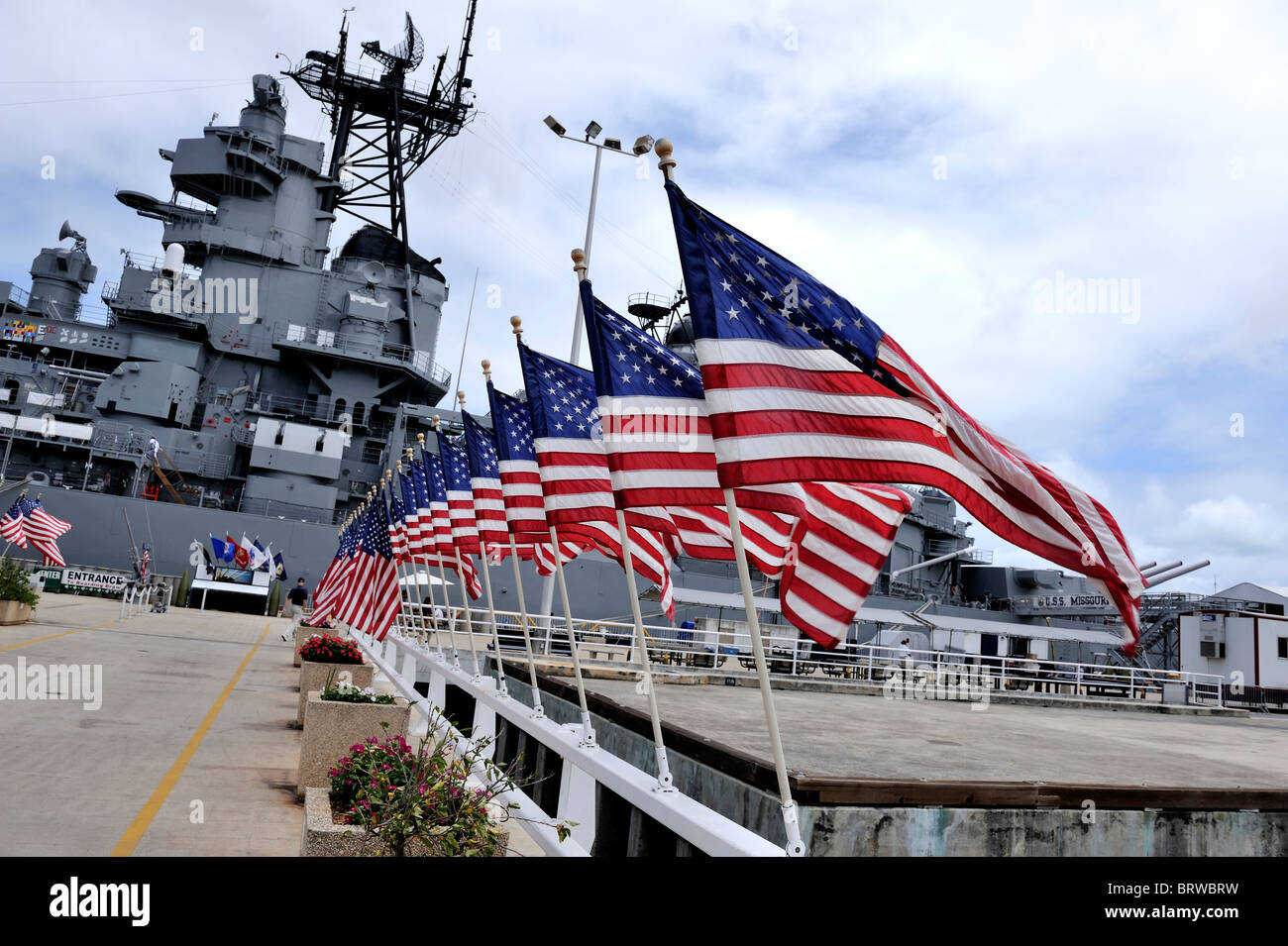 Approach to the USS Missouri, lined with USA flags. Battleship Missouri Memorial, Pearl Harbour, Hawaii Stock Photo