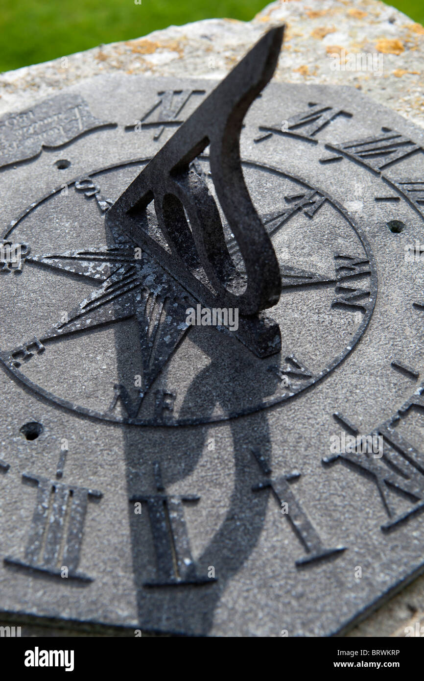 Sundial with gnomon casting shadow Stock Photo