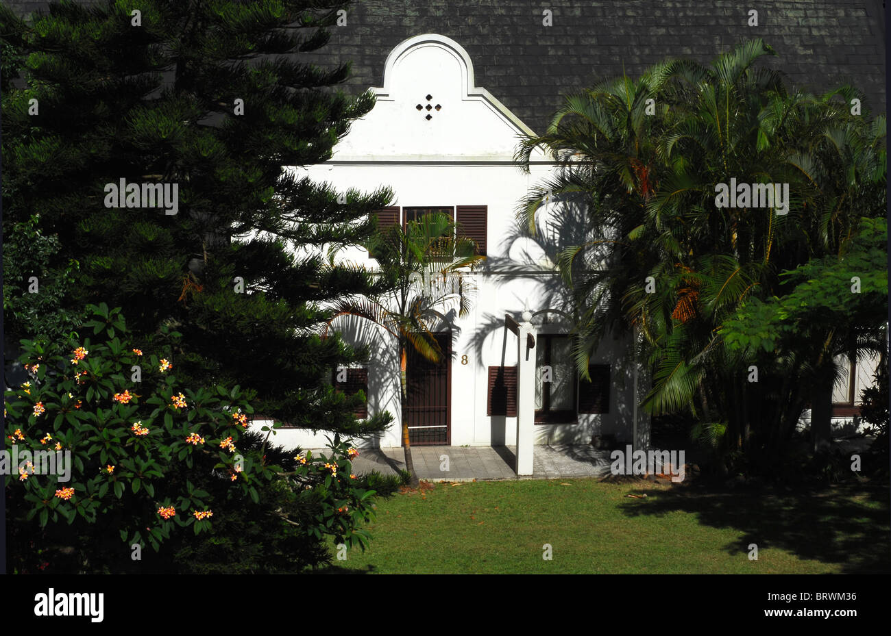 A Cape Dutch House in lush garden in Durban, South Coast,  South Africa. Stock Photo