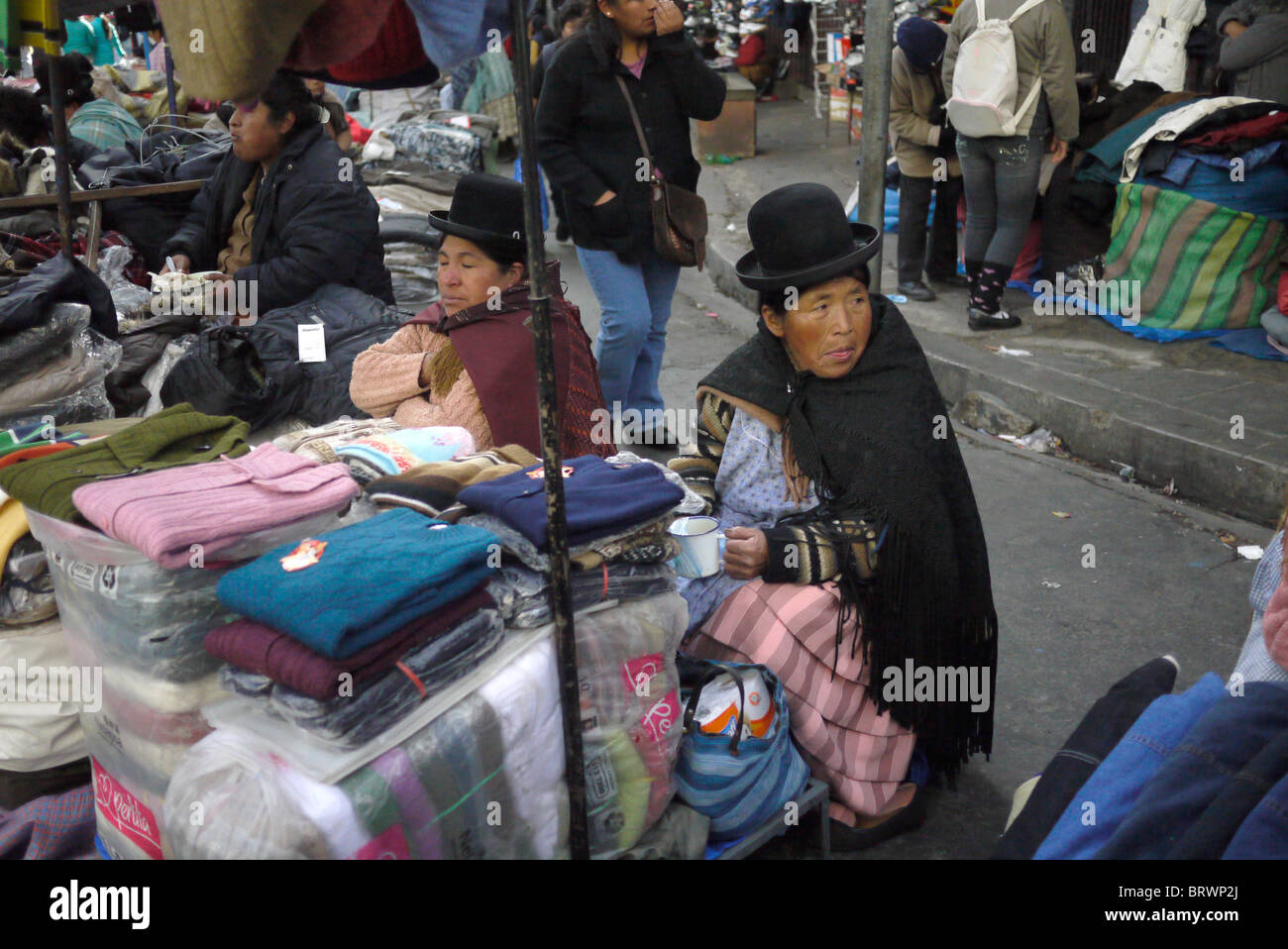BOLIVIA Street scenes in El Alto. Aymara women selling clothes. photograph by Sean Sprague Stock Photo