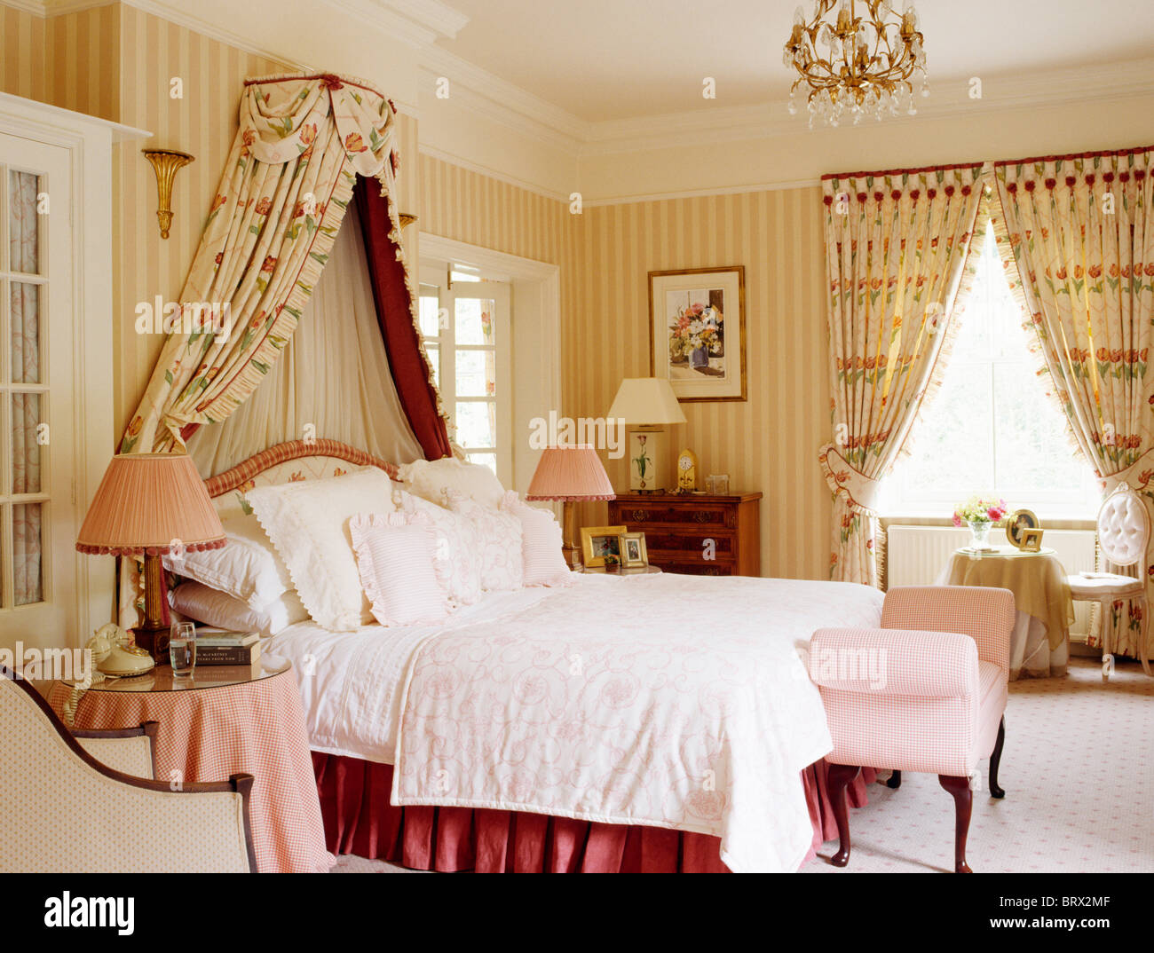 Coronet With Floral Drapes Above Bed With Pale Pink Quilt