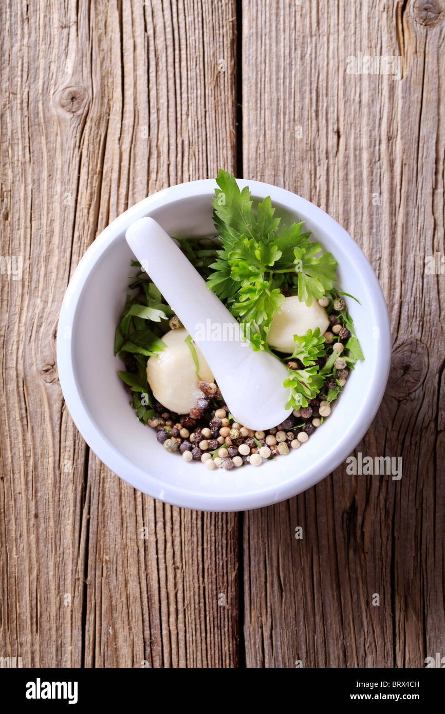 Mortar and pestle with ingredients ready to be ground Stock Photo Alamy