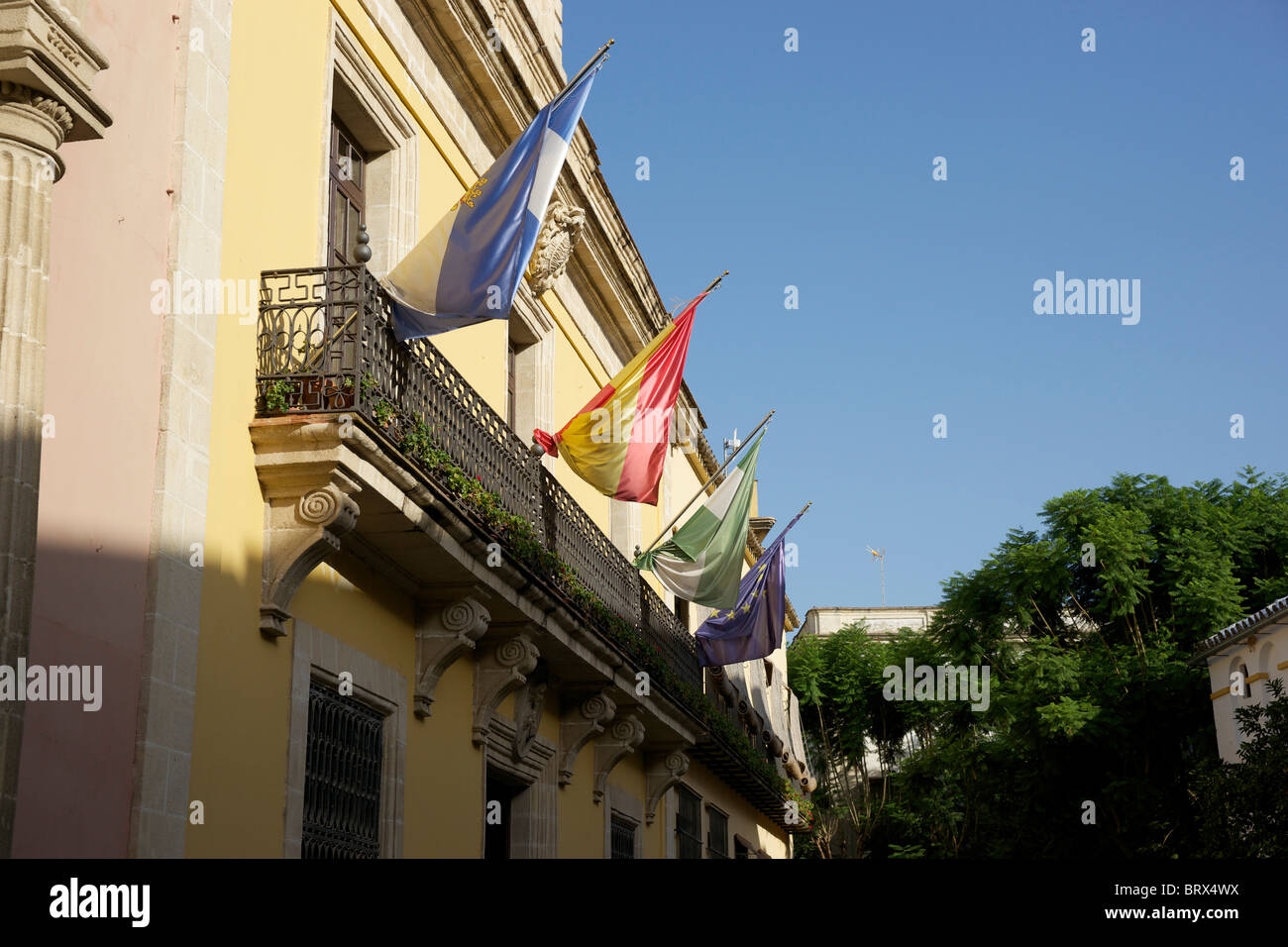 Flags flying on a building in Jerez. Stock Photo