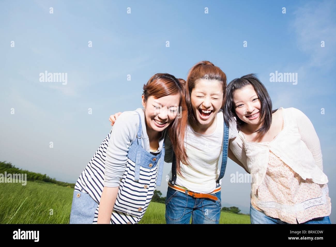 Three young japanese women laughing hi-res stock photography and images ...