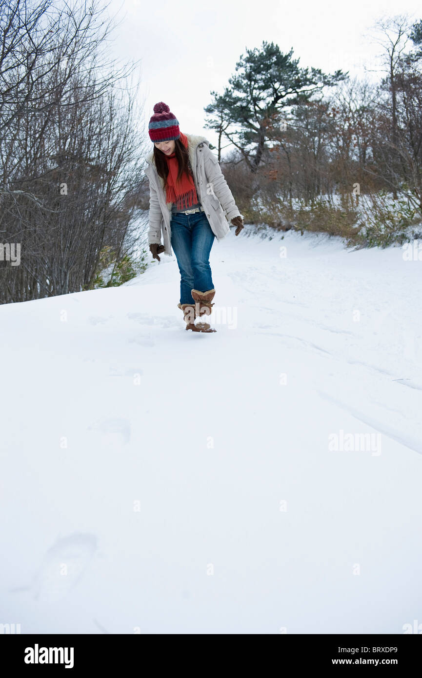 Woman walking in snow view hi-res stock photography and images - Alamy
