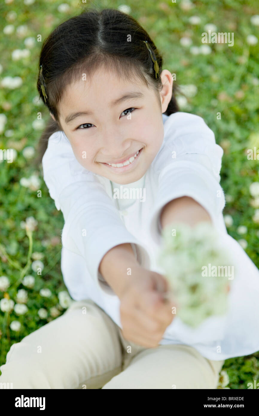 Portrait of Young Girl With Bunch of Flowers Stock Photo