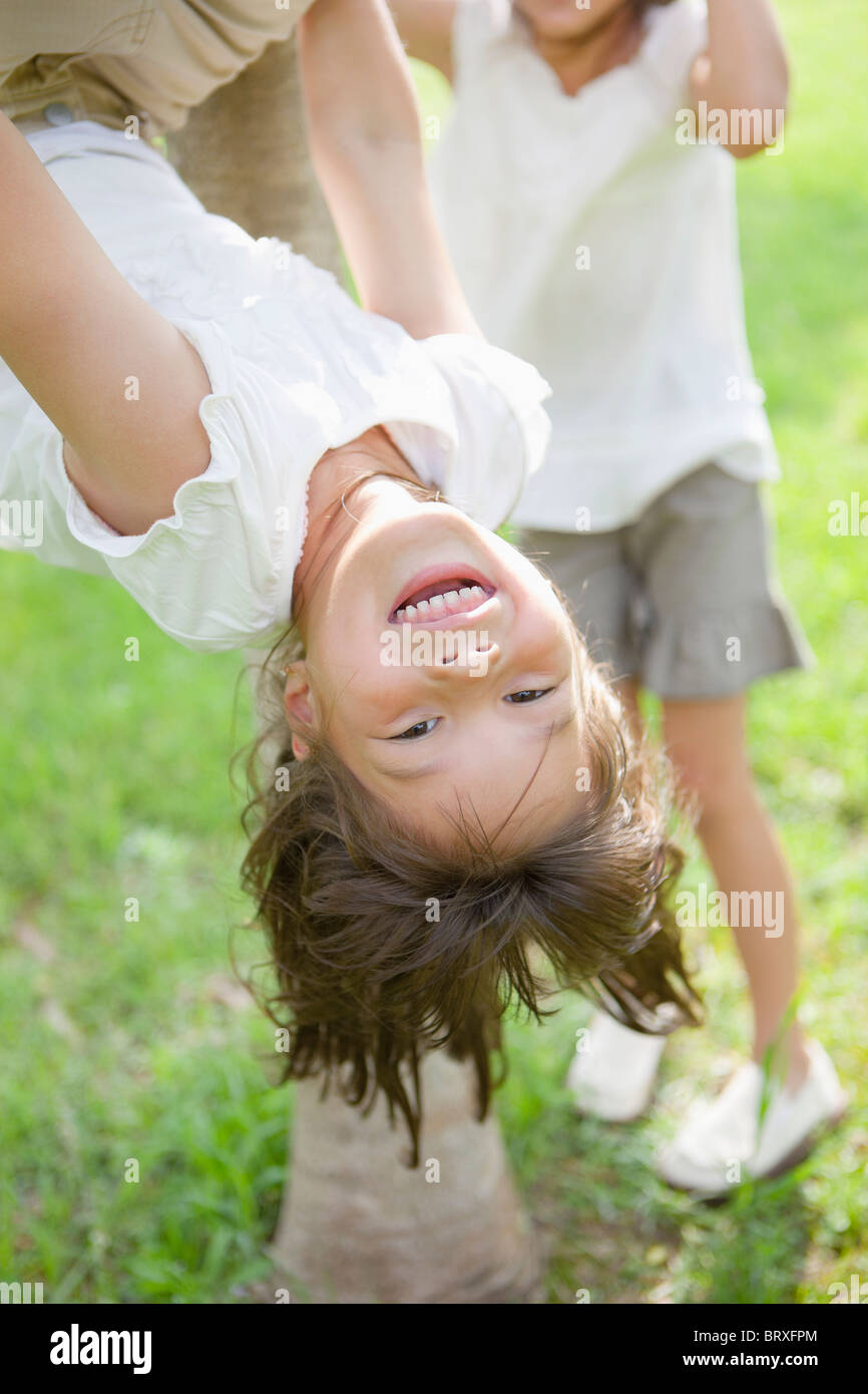 Girl Hanging Upside Down Stock Photo