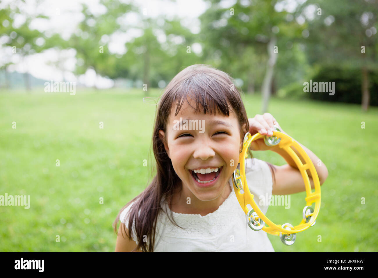 Playing tambourine hires stock photography and images Alamy