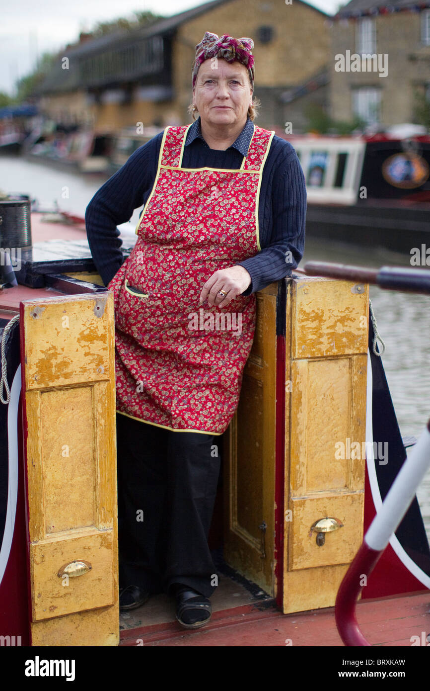 Inland Waterways Woman Narrow Boat Captain in Apron & Headscarf Stock Photo